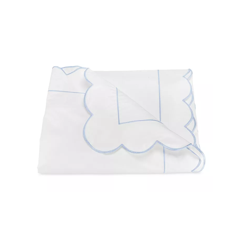 this is an image of a scalloped white duvet cover